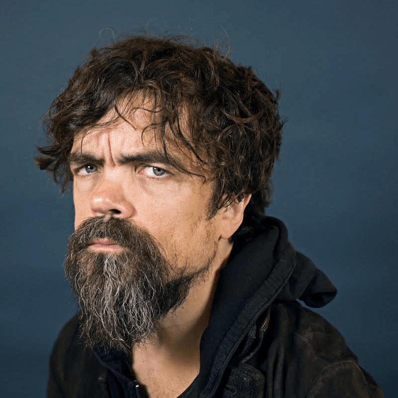 Image is a headshot of Peter Dinklage, an actor for the movie Cyrano.