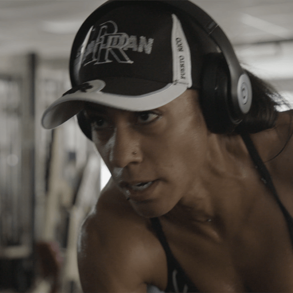 a person with headphones in a gym