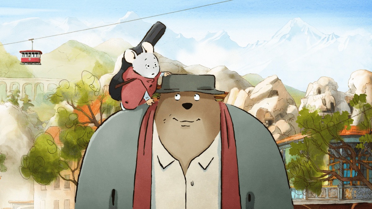 a mouse wearing a red poncho and a guitar case around his back stands on the shoulder of a bear wearing a hat and clothes.